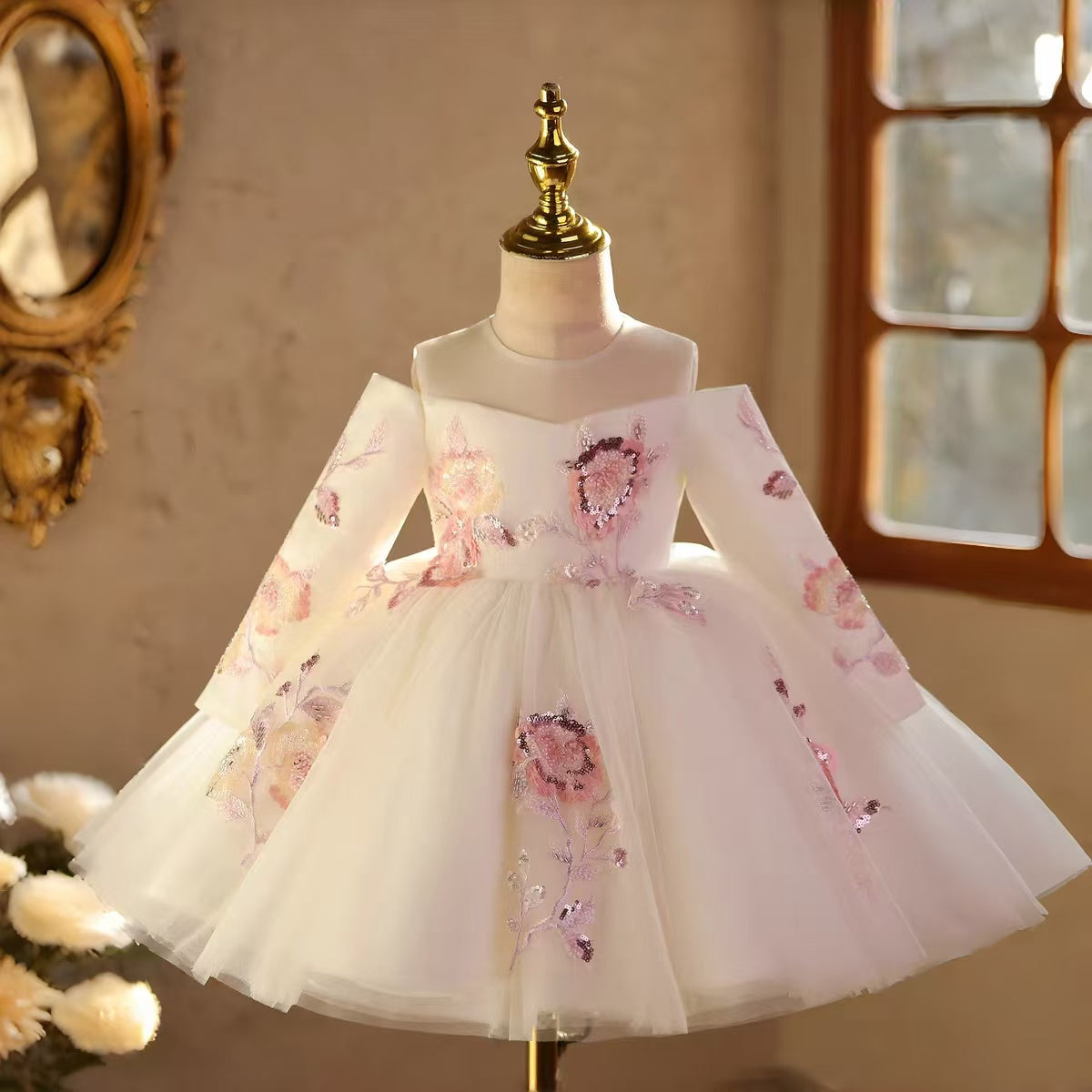 White long sleeve princess flower girl dress with a full skirt for weddings and formal parties