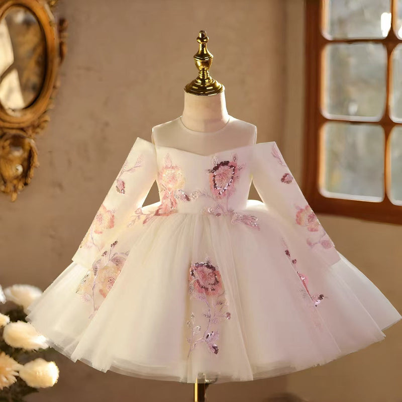White long sleeve princess flower girl dress with a full skirt for weddings and formal parties