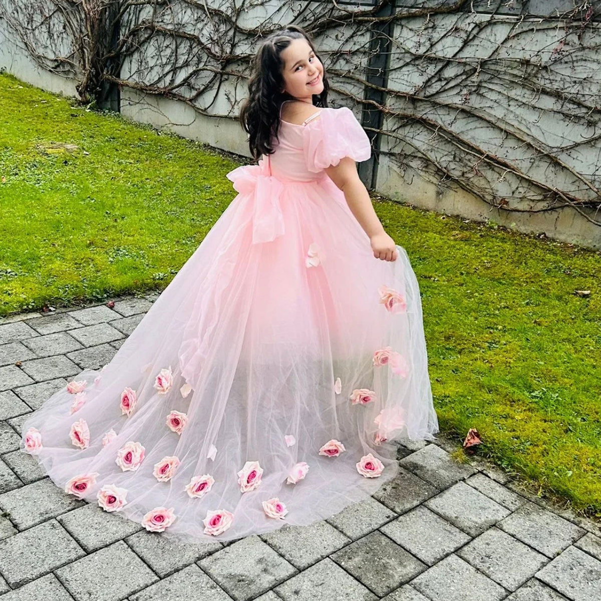 Pink flower girl dress with floral details and princess silhouette