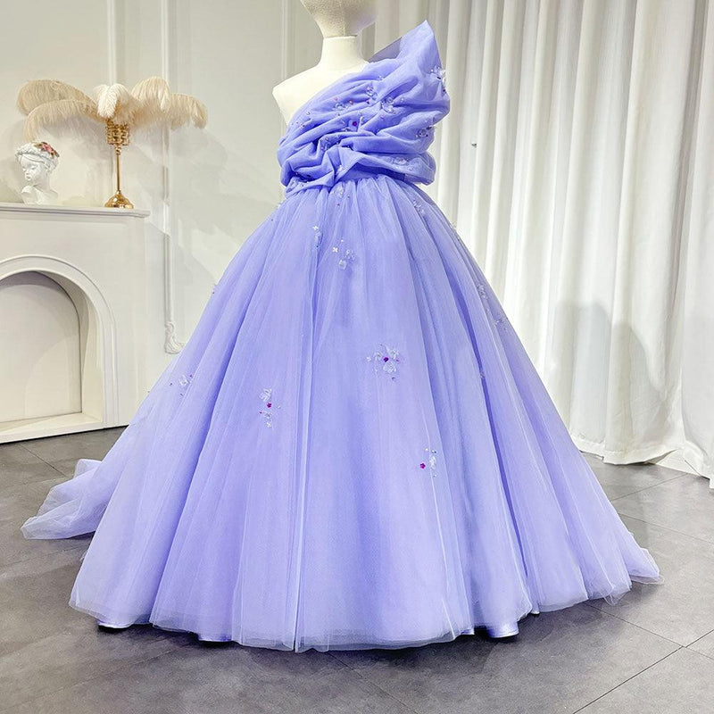 Lilac flower girl dress with handmade flowers and a full princess skirt for formal weddings