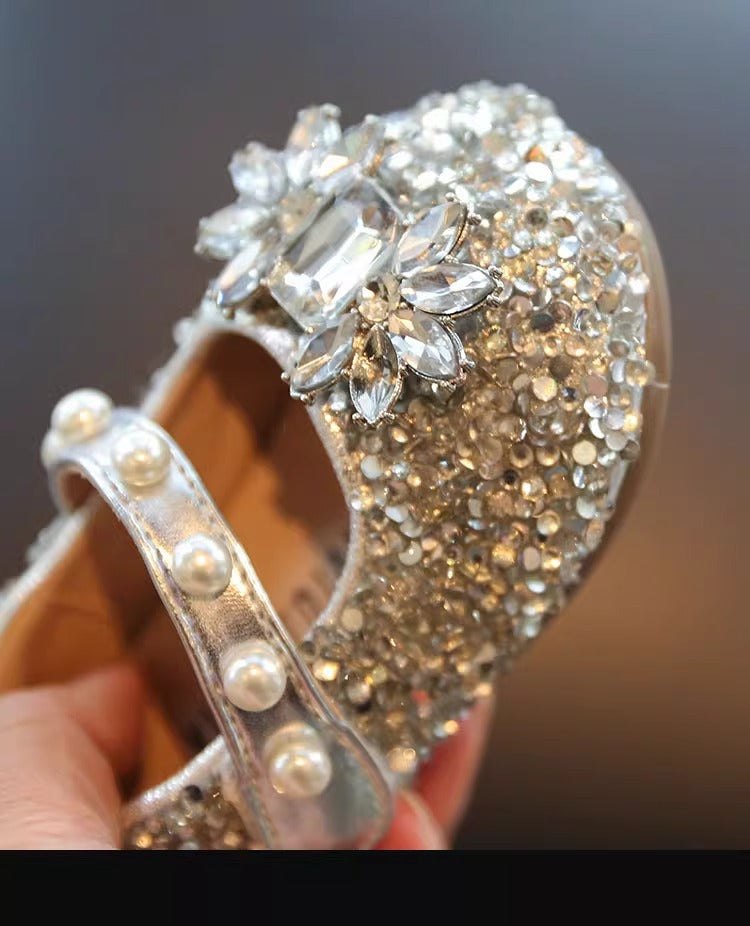 Detail of girls' silver pearl rhinestone Mary Jane flats