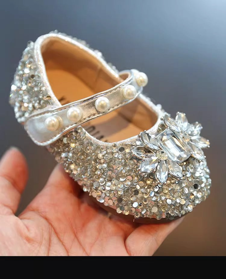 Detail of girls' silver pearl rhinestone Mary Jane flats