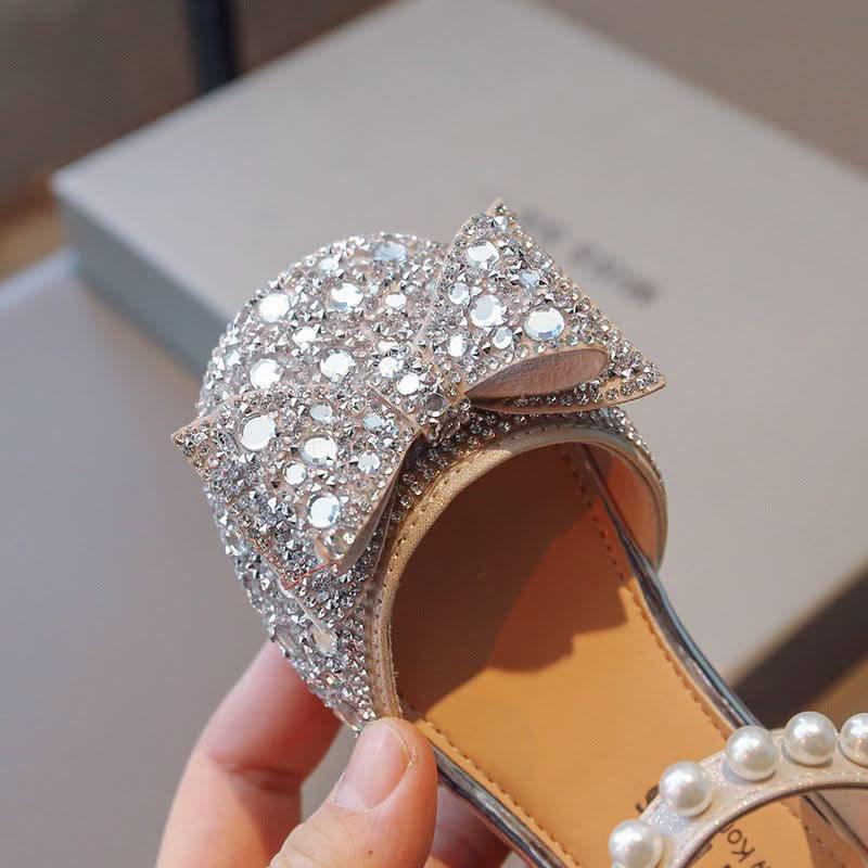 Detail of girls' pink pearl bow rhinestone Mary Jane flats