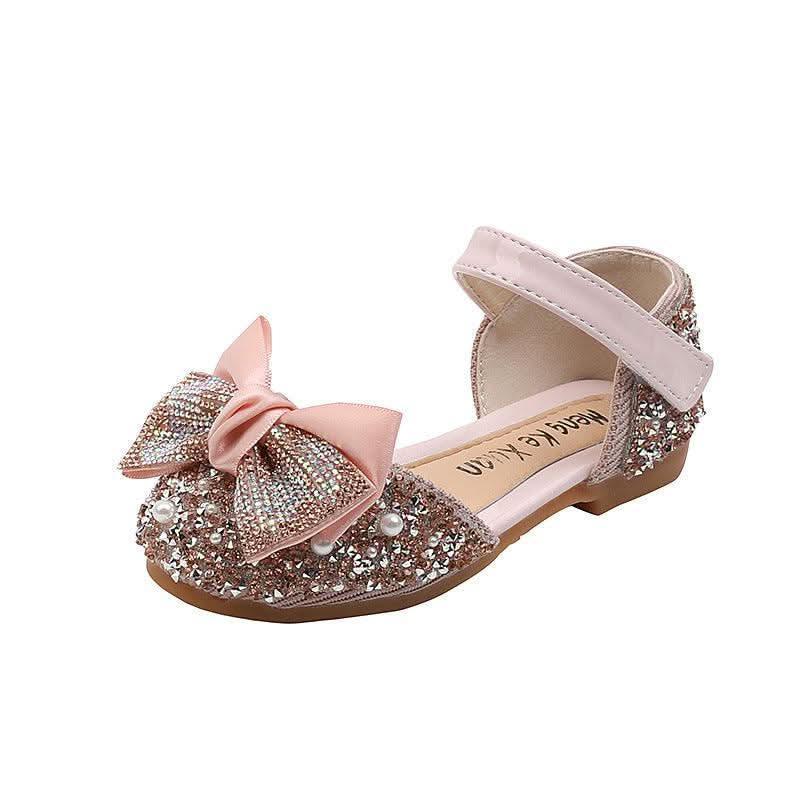 Pink rhinestone bow ankle strap flats for girls, side view